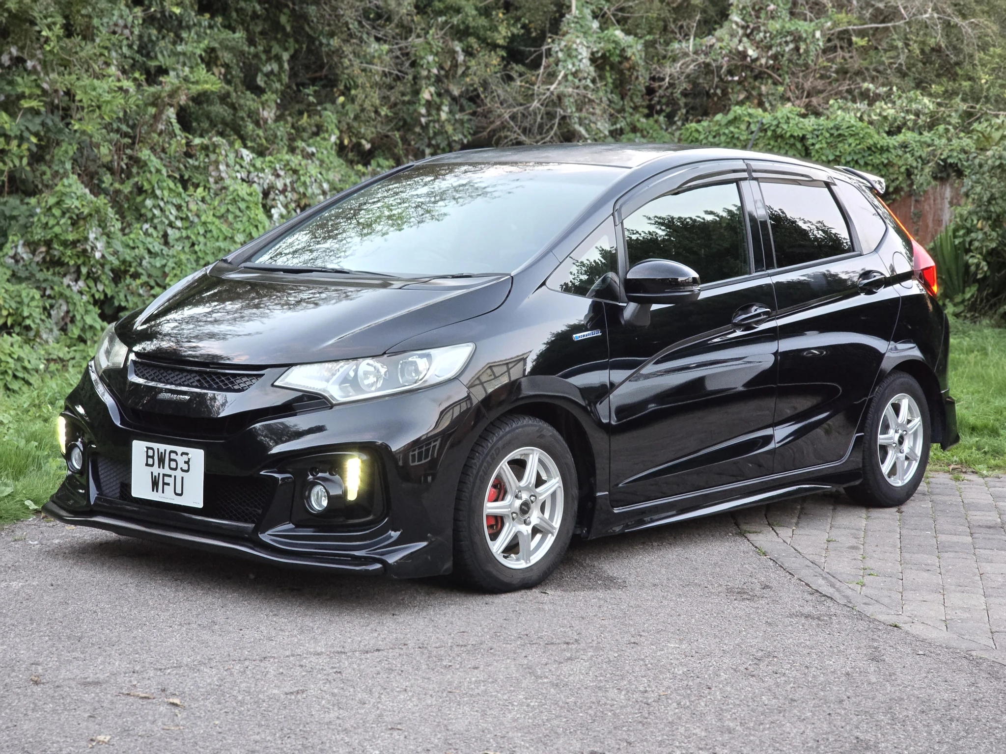 Our black Honda Fit Hybrid — Front three-quarter