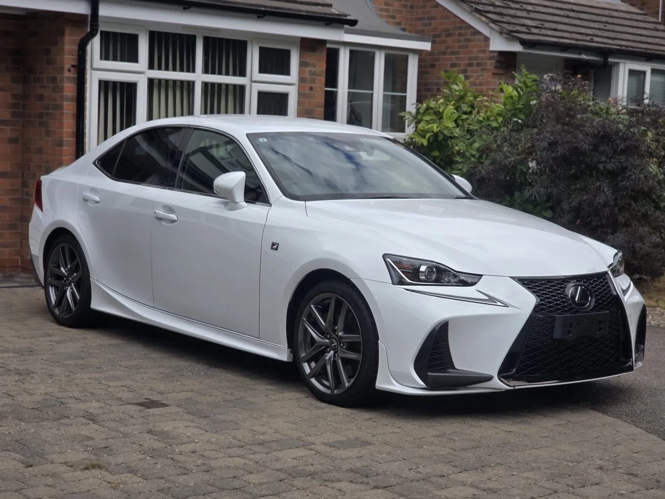 Our white Japanese-market 2017 Lexus IS350 F Sport, photographed from the front three-quarter angle with no registration displayed